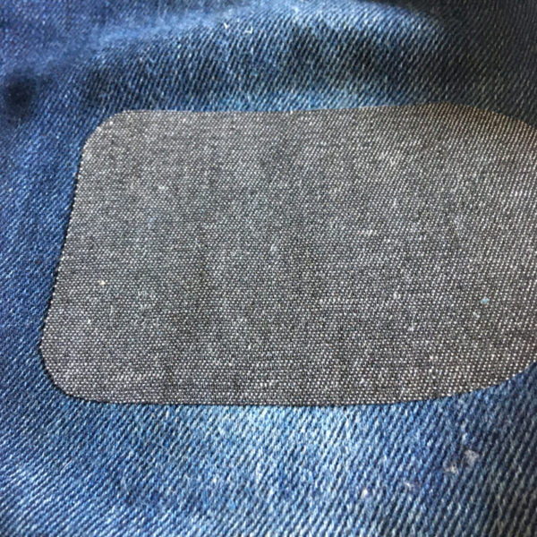 Svart påstruken lapp jeans