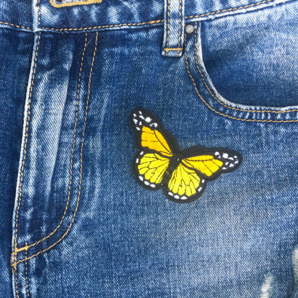 Fjäril gul jeans - tygmärke