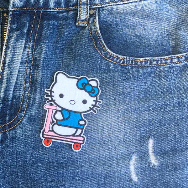Hello Kitty skooter jeans - tygmärke