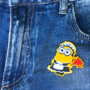 Minions dammvippa jeans - tygmärke