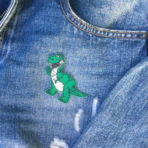 toy story rex jeans - tygmärke