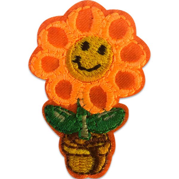 Orange blomma i kruka - Tygmärke
