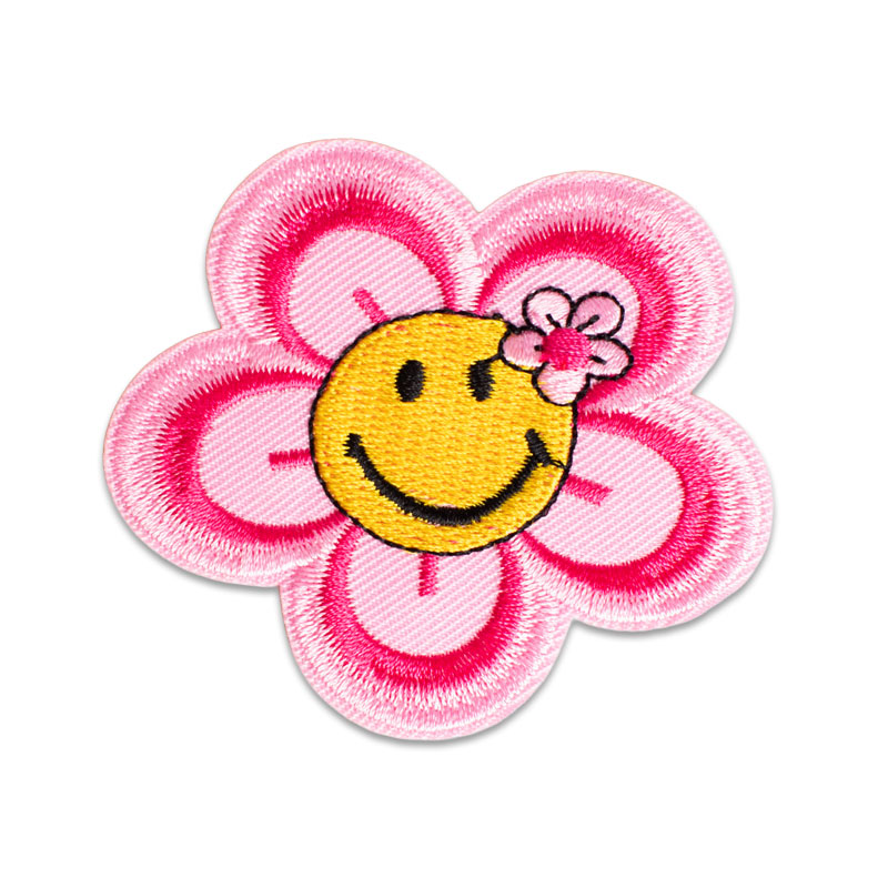 Rosa blomma smiley som är glad