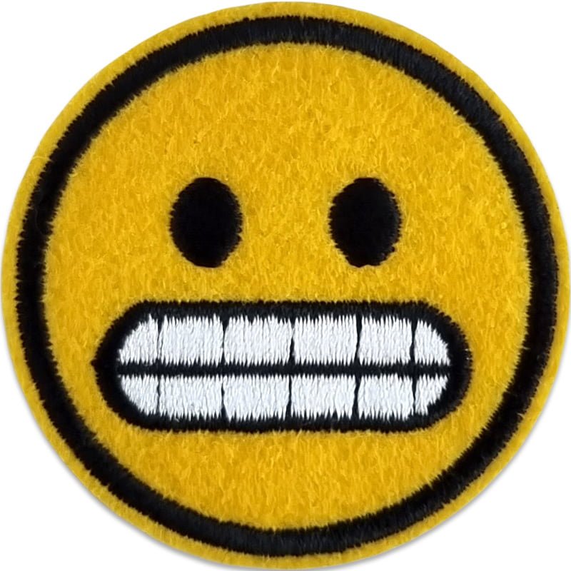 Smiley grimas - Tygmärke