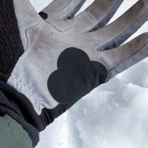 självhäftande laglapp i stretch på handske